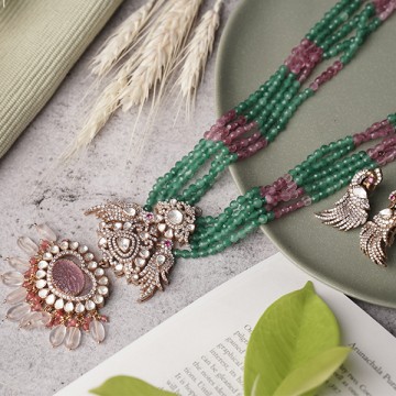 Silver chain with green...